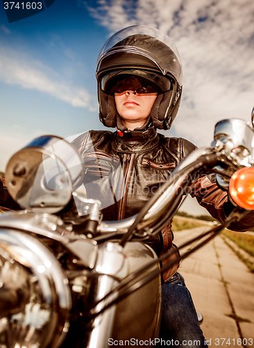 Image of Biker girl on a motorcycle