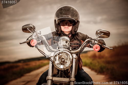 Image of Biker girl on a motorcycle