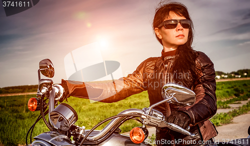 Image of Biker girl on a motorcycle