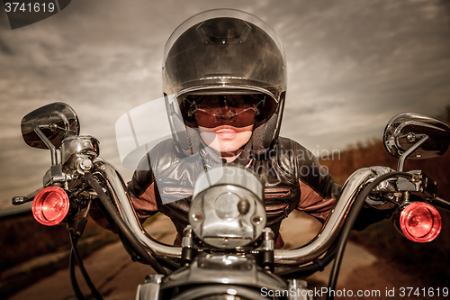 Image of Biker girl on a motorcycle