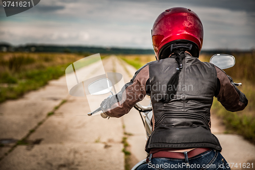 Image of Biker girl on a motorcycle