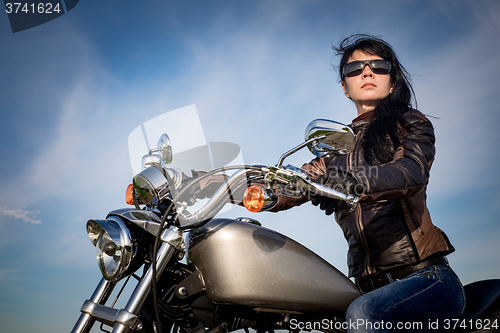 Image of Biker girl on a motorcycle