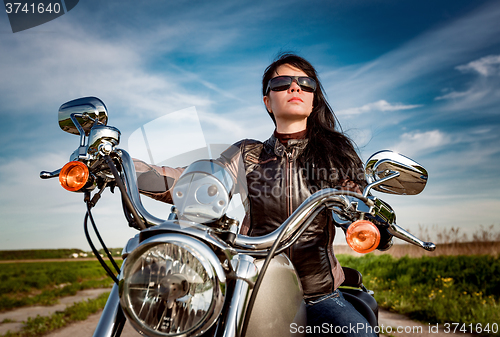 Image of Biker girl on a motorcycle