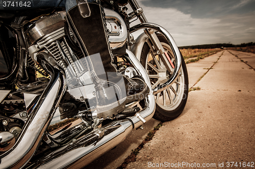 Image of Biker girl riding on a motorcycle