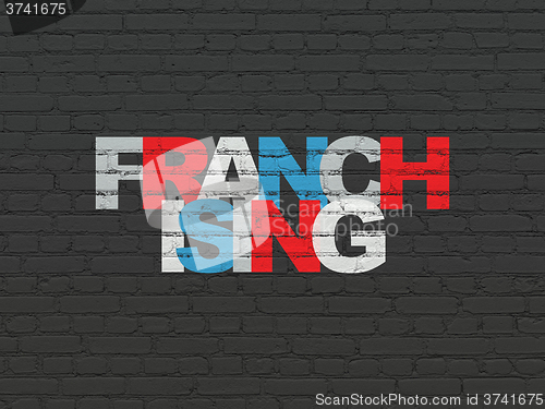 Image of Business concept: Franchising on wall background