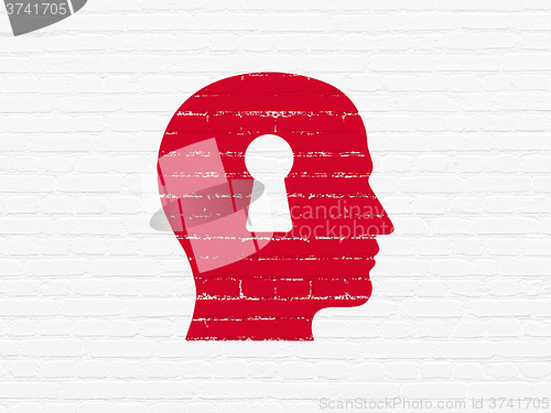 Image of Marketing concept: Head With Keyhole on wall background