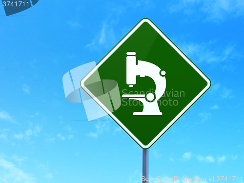 Image of Science concept: Microscope on road sign background