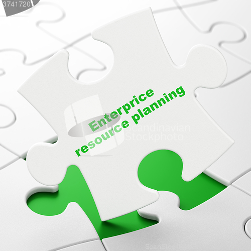 Image of Business concept: Enterprice Resource Planning on puzzle background