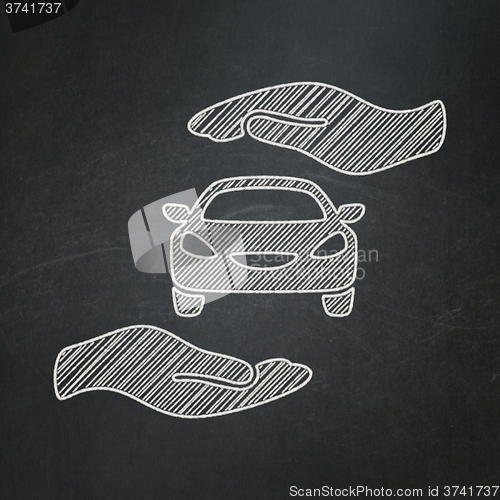 Image of Insurance concept: Car And Palm on chalkboard background