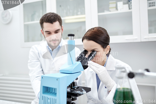 Image of young scientists making test or research in lab