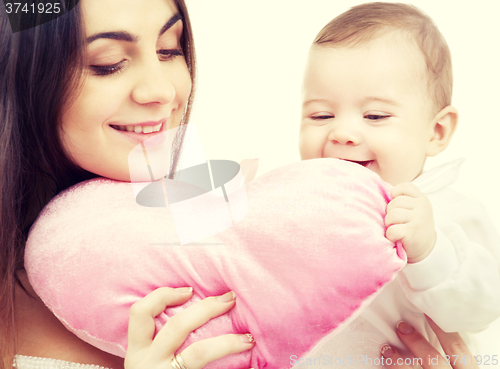 Image of baby and mama with heart-shaped pillow