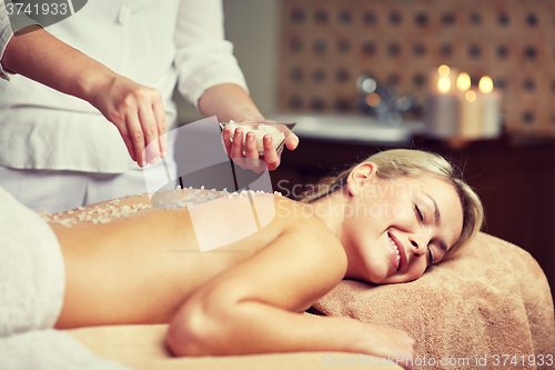 Image of close up of woman lying and having massage in spa