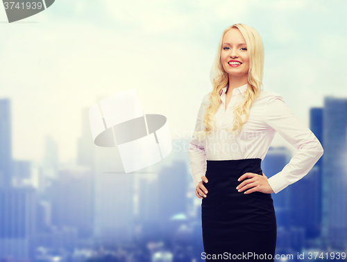 Image of smiling businesswoman or secretary over city