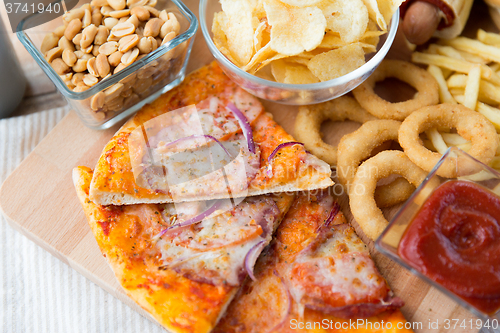 Image of close up of fast food snacks and drink on table