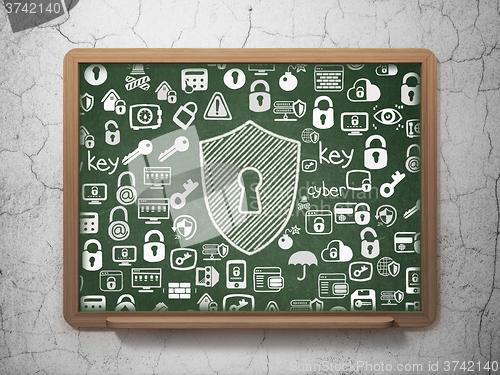 Image of Protection concept: Shield With Keyhole on School Board background