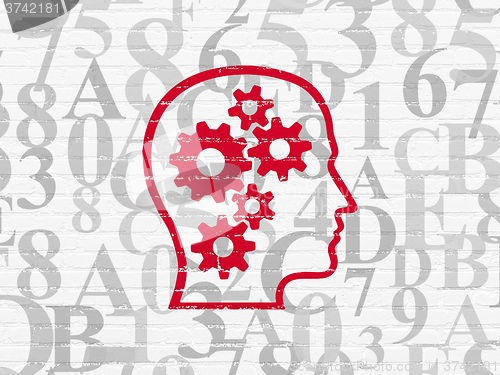 Image of Information concept: Head With Gears on wall background