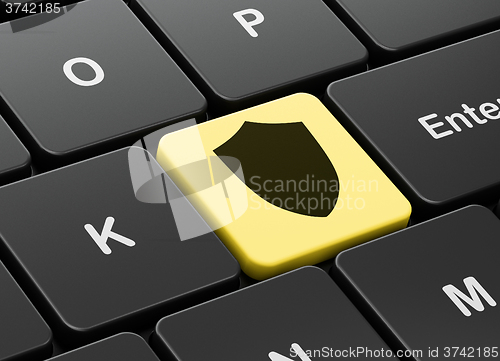 Image of Safety concept: Shield on computer keyboard background