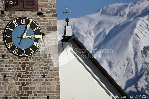 Image of Detail view of a clock on a church tower