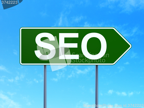 Image of Web development concept: SEO on road sign background