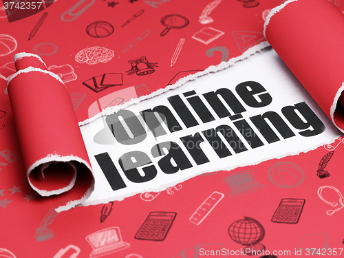 Image of Studying concept: black text Online Learning under the piece of  torn paper