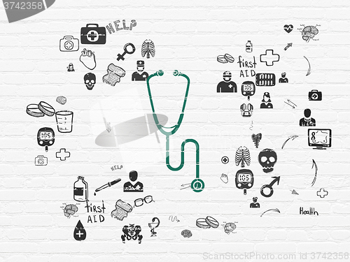 Image of Medicine concept: Stethoscope on wall background