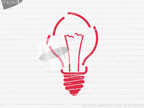 Image of Finance concept: Light Bulb on wall background