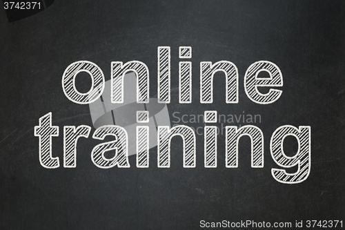 Image of Studying concept: Online Training on chalkboard background