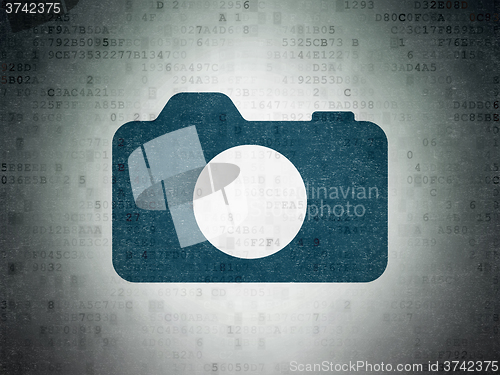 Image of Vacation concept: Photo Camera on Digital Paper background