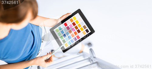 Image of woman working with color samples