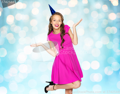 Image of happy young woman or teen girl in party cap