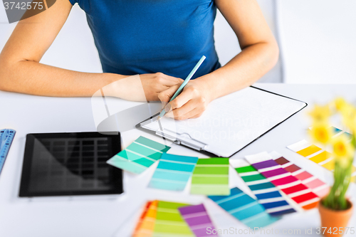 Image of woman working with color samples for selection