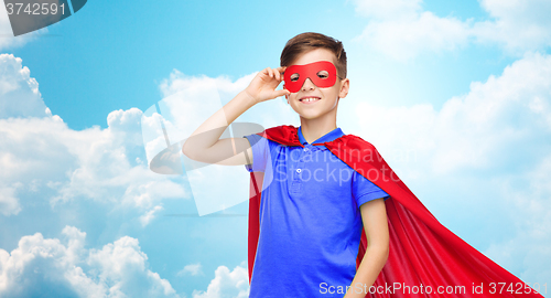 Image of boy in red superhero cape and mask