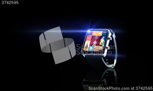 Image of close up of smart watch with media application