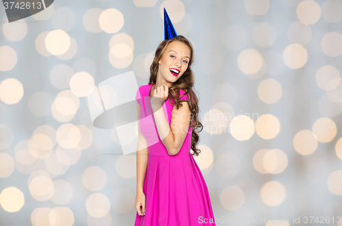 Image of happy young woman or teen girl in party cap