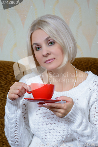 Image of Blonde with a red cup