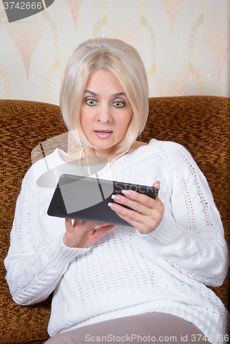 Image of Blonde with a tablet PC