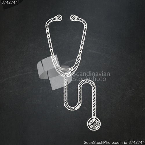 Image of Health concept: Stethoscope on chalkboard background