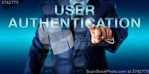 Image of Executive Pressing USER AUTHENTICATION Onscreen