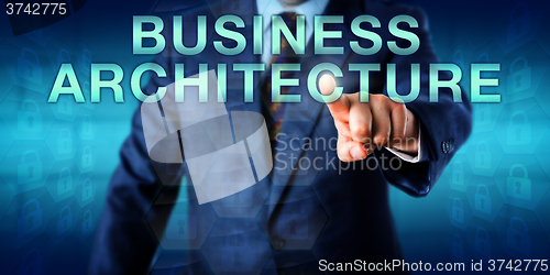 Image of Executive Touching BUSINESS ARCHITECTURE Onscreen