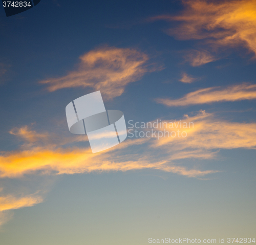 Image of the sunrise in  colored sky white soft clouds and abstract backg