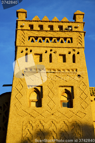 Image of old brown construction in africa morocco and sky  near the 