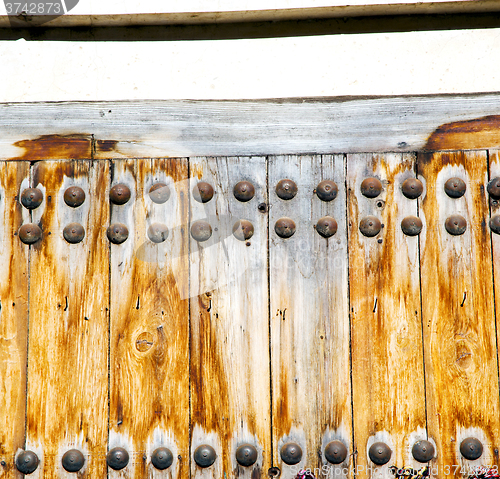 Image of brown  morocco in africa the old wood  facade home and rusty saf