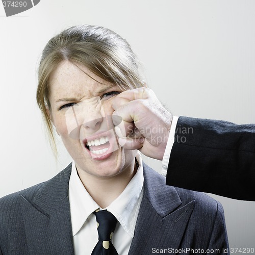 Image of Punched businesswoman