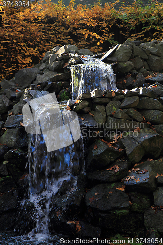 Image of small waterfall in the sun light