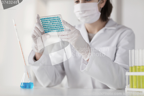 Image of close up of scientist making test in lab