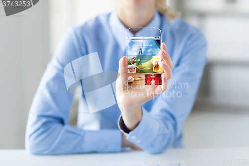 Image of close up of woman with application on smartphone