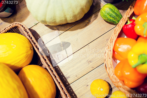 Image of vegetables in baskets on table at market or farm