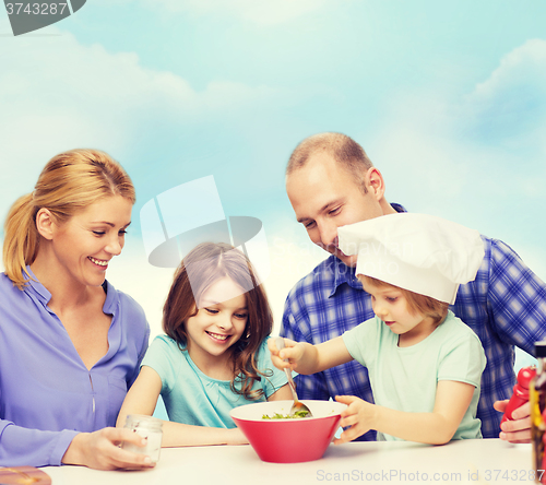 Image of happy family with two kids eating at home