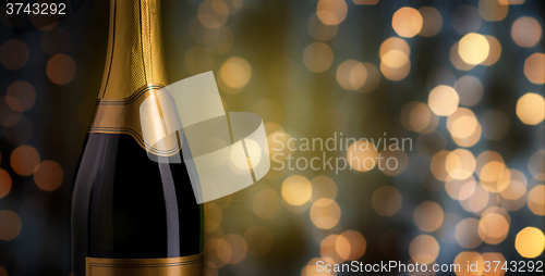 Image of close up of champagne bottle with blank label