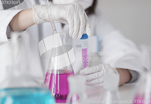 Image of close up of scientist making test in lab